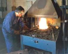 picture of blacksmith working at forge